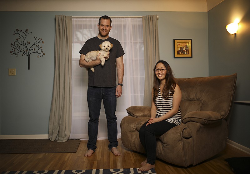Anthony and Amy Ongaro with their dog, Rocky, in their south Minneapolis home.