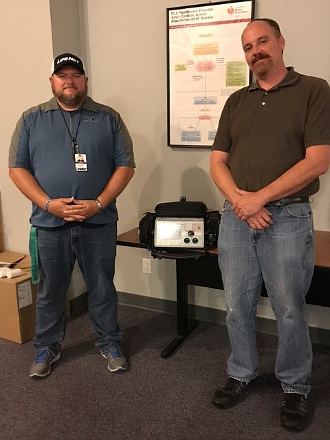 Jarrod Nall, left, clinical manager at LifeNet in Texarkana, presents a Zoll M Series cardiac monitor/defibrillator to Mark Wilcox, Emergency Medical Services instructor at University of Arkansas at Texarkana. (Submitted photo)