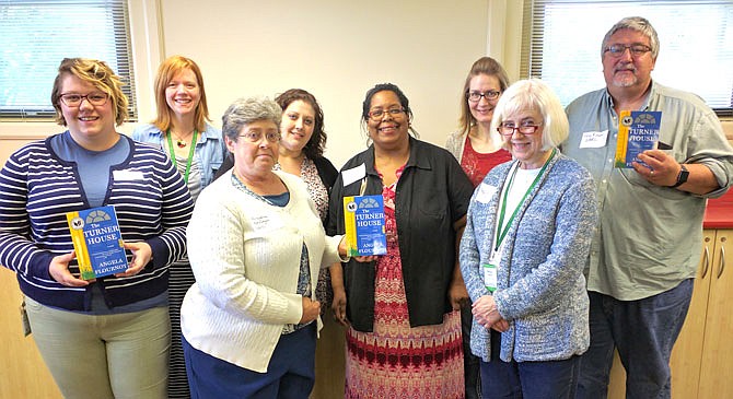 Members of the One Read Task Force, from left, Kat Stone Underwood (DBRL), Lauren Williams (DBRL), Angela Grogan (Westminster College), Jill Mahoney (William Woods University), Sherry McBride (Callaway County Public Library), Rachel Utrecht (William Woods University), Betsy Collins (DBRL) and Greg Reeves (CCPL), proudly announce this year's One Read book is "The Turner House" by Angela Flournoy.