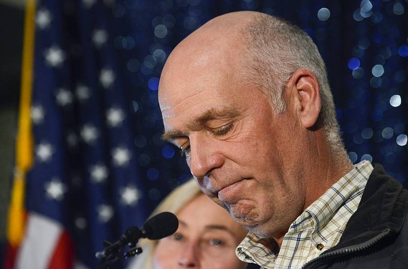 Greg Gianforte celebrates his win over Rob Quist for the open congressional seat at the Hilton Garden Inn, Thursday night, May 25, 2017, in Bozeman, Mont. The Republican multimillionaire Gianforte won Montana's only U.S. House seat on Thursday despite being charged a day earlier with assault after witnesses said he grabbed a reporter by the neck and threw him to the ground. After being declared the winner, Gianforte apologized both to Jacobs and to the Fox News crew for having to witness the attack. (Rachel Leathe/Bozeman Daily Chronicle via AP)