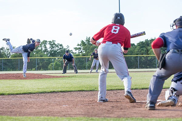 Helias pitcher Conner McKenna comes to the plate during the fifth inning of Thursday night's Class 4 quarterfinal game against Aurora at the American Legion Post 5 Sports Complex.