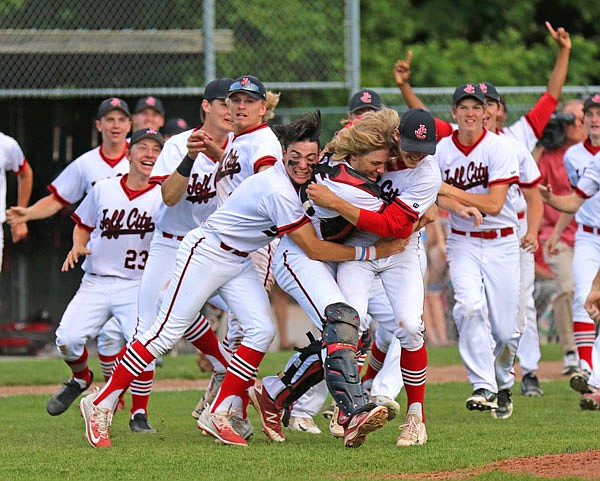 Jefferson City teammates (from left) Cole Ahrens, Gaven Strobel and Jacob Weirich celebrate following Thursday night's Class 5 quarterfinal game against Kickapoo at Vivion Field.