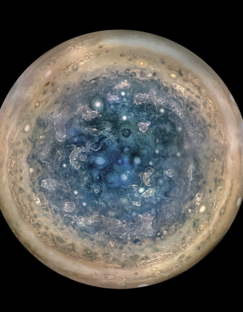 This image made available by NASA on Thursday, May 25, 2017, and made from data captured by the Juno spacecraft shows Jupiter's south pole. The oval features are cyclones, up to 600 miles in diameter. The cyclones are separate from Jupiter's trademark Great Red Spot, a raging hurricane-like storm south of the equator. The composite, enhanced color image was made from data on three separate orbits.