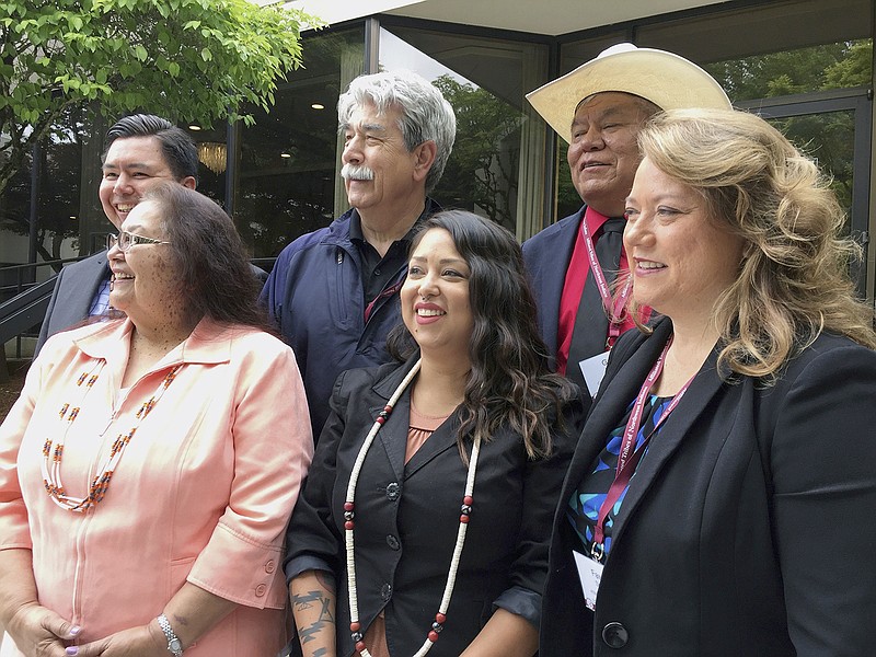 Tribal leaders from the Pacific Northwest pose for a picture Thursday during a meeting of the Members of the Affiliated Tribes of Northwest Indians in Portland, Oregon. The group held a news conference during its annual convention to criticize cuts to Native American programs in President Donald Trump's proposed budget that they say will devastate tribes across the U.S. Front from left, are Cheryl Kennedy, vice chairwoman of the Confederated Tribes of the Grand Ronde, Carina Miller, councilwoman with the Confederated Tribes of Warm Springs, and Fawn Sharp, president of the Affiliated Tribes of Northwest Indians; back from left, are Timothy Ballew, member of the Lummi Nation, Mel Sheldon, councilman with the Tulalip Tribes, and Gary Burke, chairman of the board of trustees for the Confederated Tribes of the Umatilla Indian Reservation.