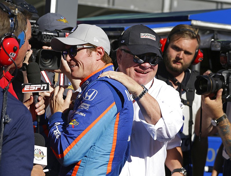 Car owner Chip Ganassi congratulates driver Scott Dixon, of New Zealand, after he won the pole during qualifications for the Indianapolis 500 IndyCar auto race at Indianapolis Motor Speedway, Sunday, May 21, 2017 in Indianapolis. 