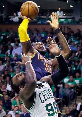 LeBron James of the Cavaliers shoots above Jae Crowder of the Celtics during  Thursday night's Eastern Conference final game in Boston.