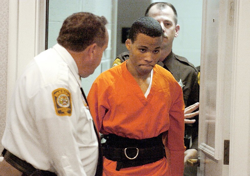 In this Oct. 26, 2004, file photo, Lee Boyd Malvo enters a courtroom in the Spotsylvania, Va., Circuit Court. A federal judge has tossed out two life sentences for D.C. sniper shooter Lee Boyd Malvo and ordered Virginia courts to hold new sentencing hearings. In a ruling issued Friday, U.S. District Judge Raymond Jackson in Norfolk said Malvo is entitled to new sentencing hearings after the U.S. Supreme Court ruled that mandatory life sentences for juveniles are unconstitutional. 