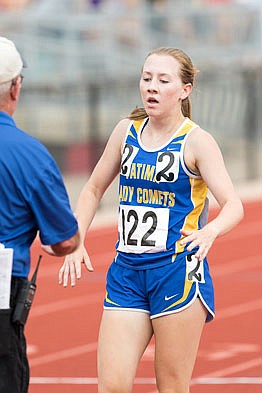 Brianna Haller of Fatima crosses the finish line of the Class 3 3,200-meter run Friday in the state track and field championships at Adkins Stadium.