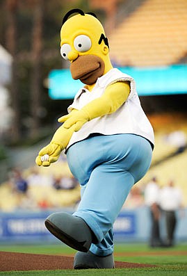 In this July 11, 2008, file photo, a person in a Homer Simpson costume throws out the first pitch before the start of a game between the Marlins and the Dodgers in Los Angeles. 