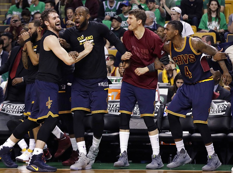 Cleveland Cavaliers, from left, Kevin Love, LeBron James, Kyle Korver and Iman Shumpert celebrate a basket during the second half of Game 5 of the NBA basketball Eastern Conference finals against the Boston Celtics, on Thursday, May 25, 2017, in Boston.