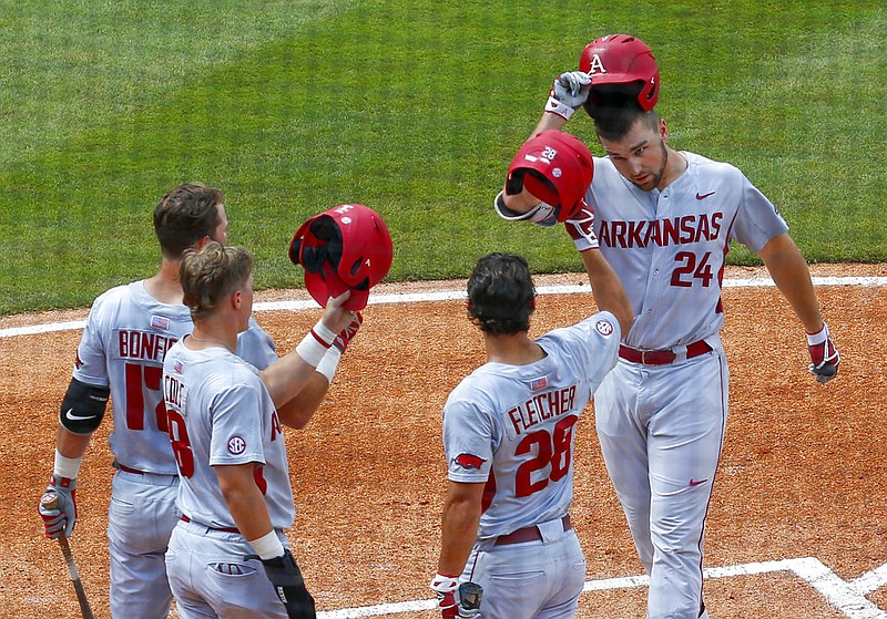 Arkansas' Chad Spanberger (24) celebrates with teammates after hitting a home run against Florida during the first inning of a game in the Southeastern Conference NCAA college baseball tournament, Saturday, May 27, 2017, in Hoover, Ala. 