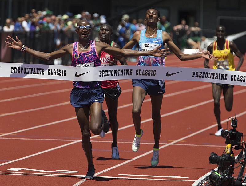 Mo Farah celebrates as he reaches to the finish line in the men's 5,000 meters in his last race in the U.S. at the IAAF Diamond League Prefontaine Classic at Hayward Field in Eugene, Ore., Saturday, May 27, 2017. 