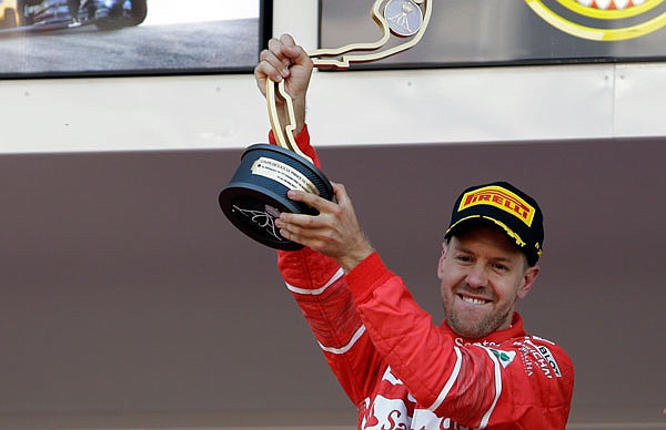 Sebastian Vettel celebrates Sunday after winning the Formula One Grand Prix at the Monaco racetrack in Monaco.