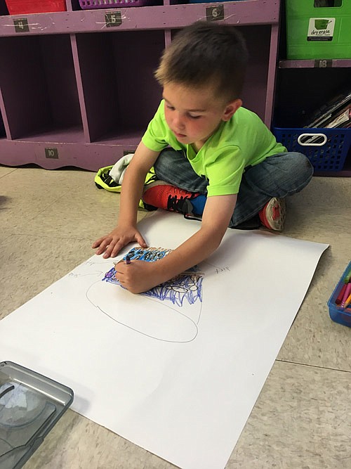 Submitted photo
First graders in Danielle Morrow's California Elementary summer school class are experimenting with the best ways to grow grass. Oren Emmerich is planning his pot's design. (submitted photo)