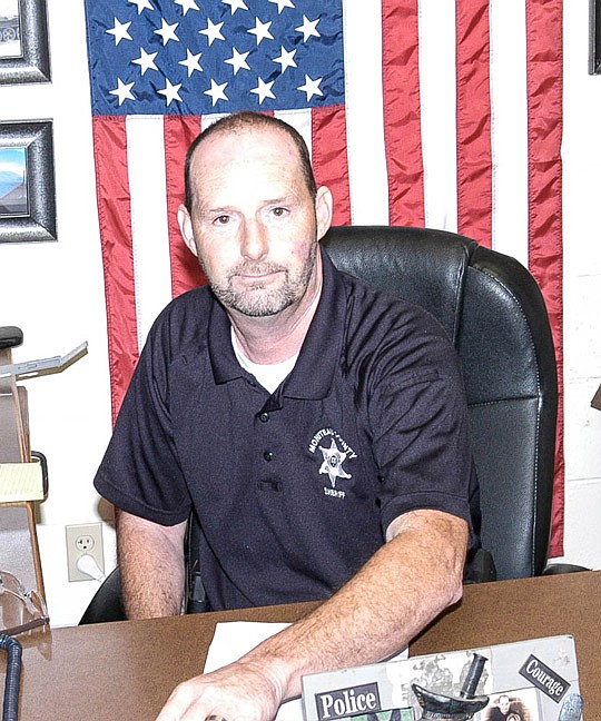 Moniteau County Sheriff Tony Wheatley poses for a photo in his office