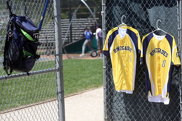 A pair of Jefferson City Renegades jerseys hang on a fence during Tuesday's practice at Vivion Field. The Renegades will make their MINK League debut at 7 p.m. today against the Sedalia Bombers at Liberty Park Stadium in Sedalia.