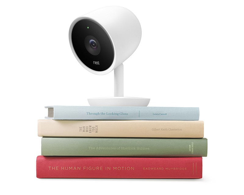 This photo provided by Nest Labs shows the Nest Cam IQ. Nest Labs is adding Google's facial recognition technology to a high-resolution security camera that will provide a glimpse at the potential for increasingly intelligent, internet-connected computers to see and understand everything going on in people's homes.