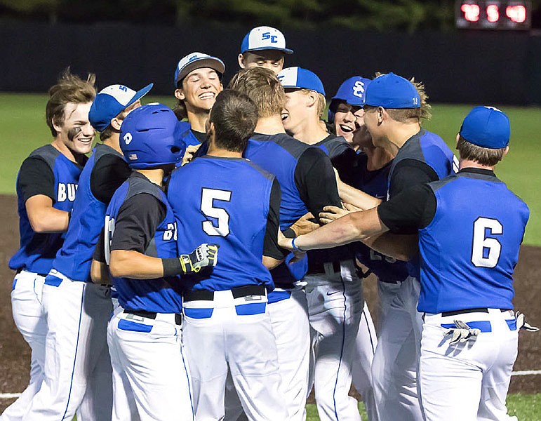 Members of the South Callaway Bulldogs celebrate after they manhandled Knob Noster 10-0 in five innings in Missouri's Class 3 semifinals Wednesday night, May 31, 2017 at CarShield Field in O'Fallon, Mo.