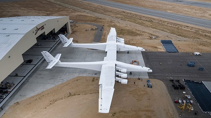 The newly built Stratolaunch aircraft is moved out of its hangar for the first time in Mojave, Calif. The aircraft will undergo ground tests in preparation for flights in which the aircraft will launch rockets from high altitude. 