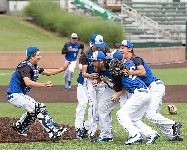 South Callaway players swarm pitcher Graysan Peneston (center) after he pitched a five-hitter Thursday afternoon in a 4-0 win against Valley Park in the Class 3 state championship game at CarShield Field in O'Fallon.