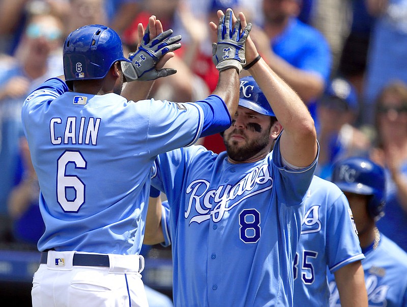 Kansas City Royals center fielder Lorenzo Cain (6) is congratulated by Kansas City Royals third baseman Mike Moustakas (8) following his two-run home run in the fifth inning of a baseball game against the Cleveland Indians at Kauffman Stadium in Kansas City, Mo., Saturday, June 3, 2017. 