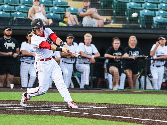 Gaven Strobel of Jefferson City smacks a grand slam during the fifth inning of Friday night's Class 5 semifinal game against Lee's Summit in O'Fallon.