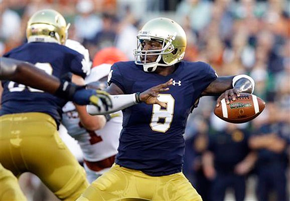 In this Sept. 5, 2015, file photo, Notre Dame quarterback Malik Zaire looks to a pass during the first half of a game against Texas in South Bend, Ind. The Southeastern Conference tweaked its graduate transfer policy Friday, making changes that would allow Zaire to play at Florida this season.