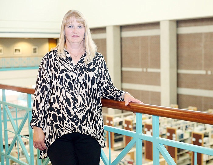 Julie Stegeman poses near her office in the Missouri Secretary of State's building. Stegeman is director of publications for the state.