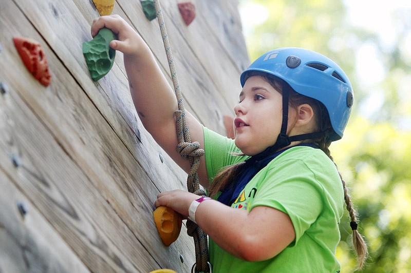 Ryan Garthoeffner, 12, climbs a rock wall Saturday, June 4, 2017 during Camp MAGIC at Jefferson City's Binder Park. SSM Health at Home Hospice offered a one-day grief retreat called Camp MAGIC (Mending A Heart, Grief in Children) to help children who have experienced the loss of a loved one.