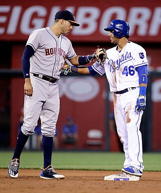 Ramon Torres of the Royals is congratulated by Astros shortstop Carlos Correa after hitting an RBI double for his first major league hit during the fourth inning of Wednesday night's game at Kauffman Stadium.