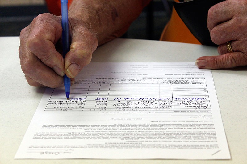 Willard Weider signs a petition Saturday, June 10, 2017 at the Central Missouri Carpenters Training Center to place a referendum on the ballot calling the right-to-work law into question. 