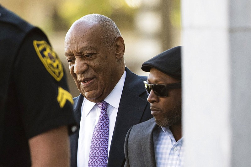 Bill Cosby arrives with Comedian Joe Torry, second from right, for his sexual assault trial at the Montgomery County Courthouse in Norristown, Pa., Friday, June 9, 2017. 