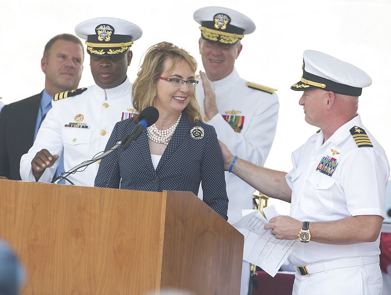 Former Arizona congresswoman Gabrielle Giffords speaks during a commissioning ceremony for the USS Gabrielle Giffords in Galveston, Texas on Saturday, June 10, 2017. The new warship named after Giffords who was wounded during a deadly 2011 shooting, has been put into active service following the ceremony. Giffords told a crowd at the ceremony she was honored the ship will carry her name and the vessel is "strong and tough, just like her crew." (Stuart Villanueva /The Galveston County Daily News via AP)