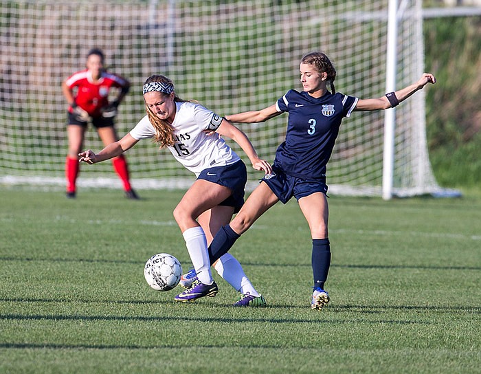 Kayla Yanskey of Helias battles Mary Maloney of St. Dominic for the ball during a game this past season at the 179 Soccer Park. Yanskey was named a Class 3 all-state first team midfielder.