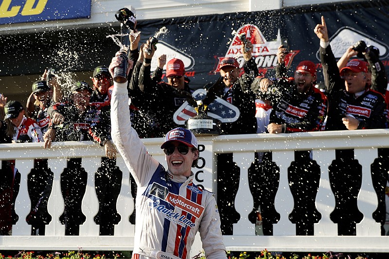 Ryan Blaney celebrates Sunday in Victory Lane after winning the NASCAR Cup Series Pocono 400 auto race in Long Pond, Pa.