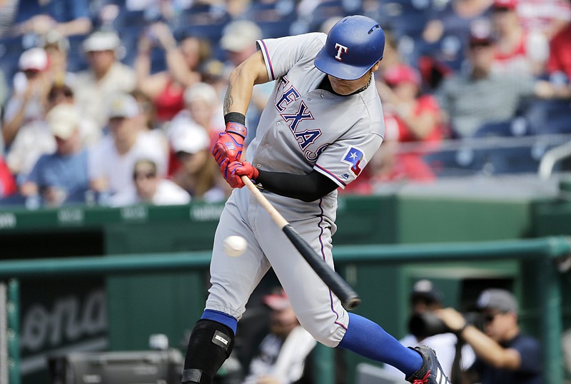 Texas Rangers' Shin-Soo Choo singles to left field Sunday during the first inning of a baseball game against the Washington Nationals in Washington.