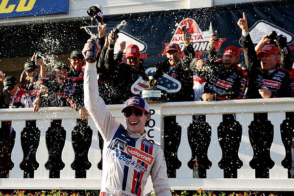 Ryan Blaney celebrates in victory lane after winning the NASCAR Cup Series Pocono 400 on Sunday in Long Pond, Pa.