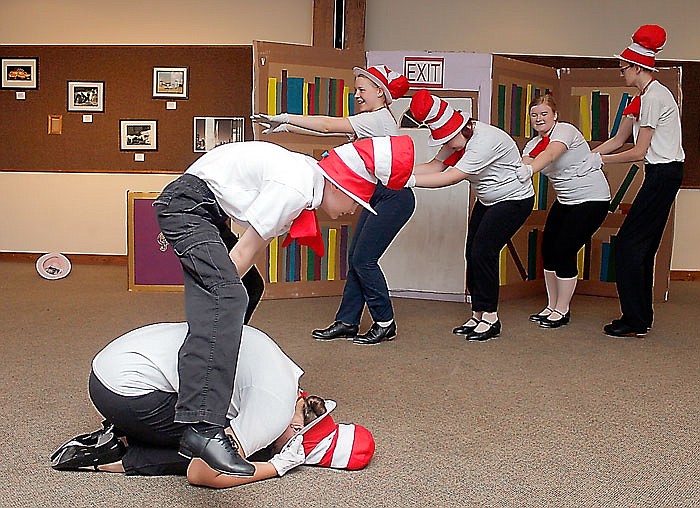 Student performers leap frog over one another s others form a conga line behind them Monday during the performance of "Help! I'm a Prisoner in the Library!" at the Missouri River Regional Library. The event featured several story-themed dances including children of all ages.
