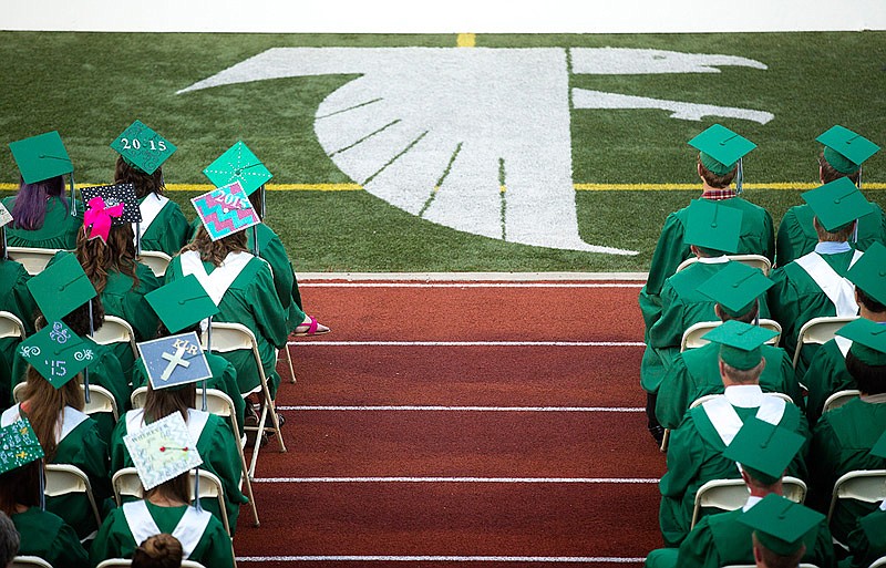 In this May 17, 2015 file photo, Blair Oaks High School graduating seniors sit in their seats during their graduation ceremony.