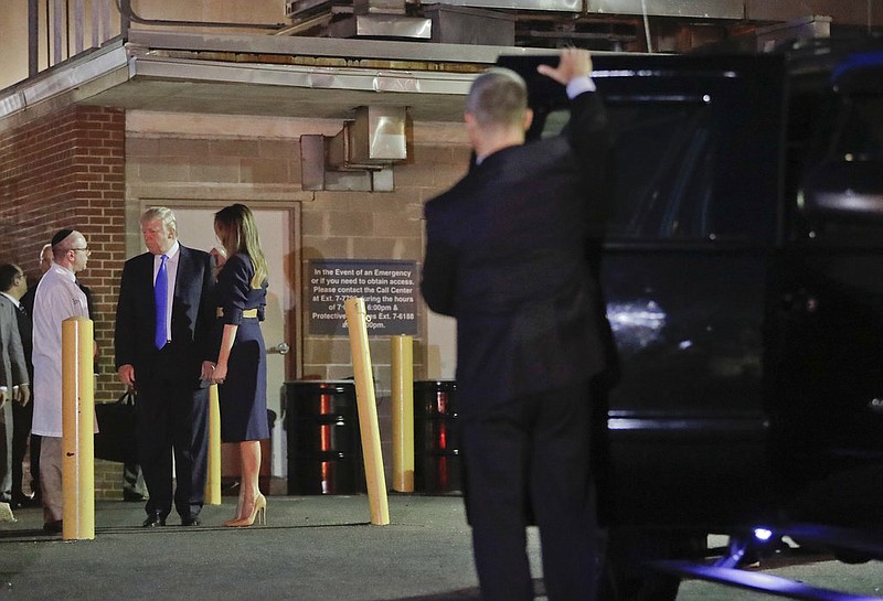 President Donald Trump and first lady Melania Trump talk with Dr. Ira Y. Rabin, left, as they prepare to leave MedStar Washington Hospital Center in Washington, Wednesday, June 14, 2017, where House Majority Leader Steve Scalise of La. was taken after being shot in Alexandria, Va., during a Congressional baseball practice.