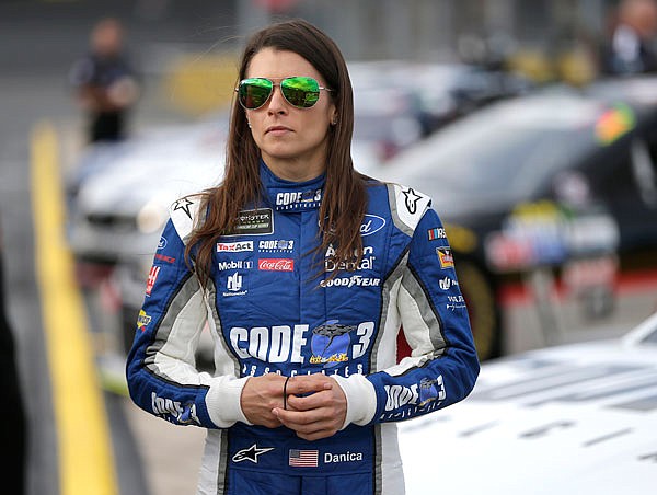 Danica Patrick stands by her car before qualifying for a NASCAR Cup series race at Charlotte Motor Speedway last month in Concord, N.C.