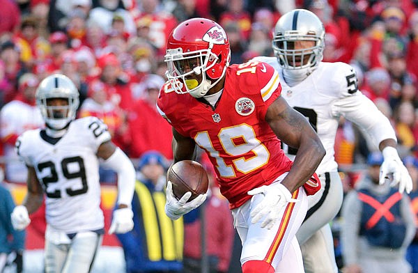 In this Jan. 3, 2016, file photo, Chiefs wide receiver Jeremy Maclin runs from Raiders cornerback David Amerson (29) and defensive end Khalil Mack (52) during the first half of a game in Kansas City.