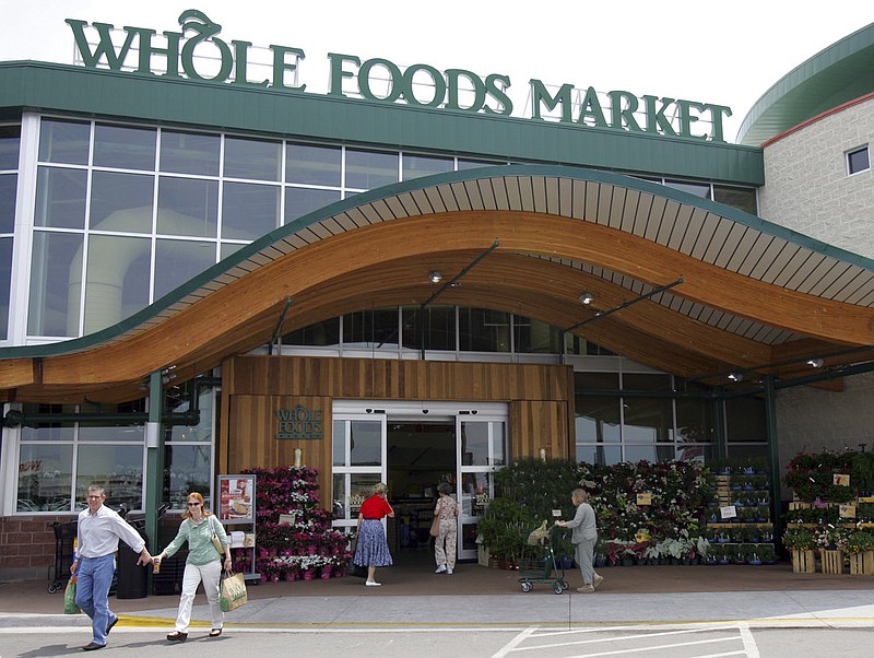  In this May 9, 2007 file photo, customers are seen outside a Whole Foods Market in Dallas. 