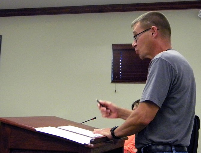 Calvin Whitlow, of Whitlow's Computer Works, thanks the Holts Summit Board of Alderman for his business license during Thursday night's meeting.