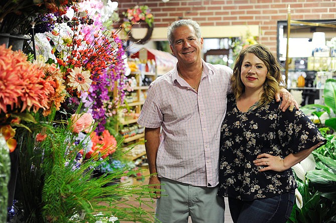 Mike Moscato owns River City Florist and Gifts with his daughter, Lauren Moscato. The store celebrated the 30th anniversary of being owned by the Moscato family on Friday.