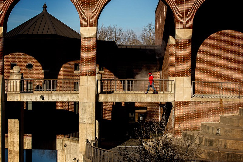 This Feb. 5, 2015, file photo shows a student crossing the pedestrian bridge near Page Library on the Lincoln University campus. 