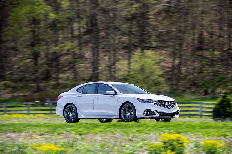 This photo provided by Honda shows the 2018 Acura TLX V6 A-Spec. Acura's top-selling car, the compact TLX, is restyled and even more of a bargain as an entry luxury sedan for 2018 and revives Acura's A-Spec name on a new performance model.