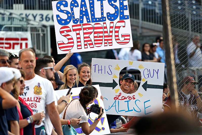 Supporters of House Majority Whip Steve Scalise, R-La., hold signs before the Congressional baseball game, Thursday, June 15, 2017, in Washington. The annual GOP-Democrats baseball game raises money for charity. 