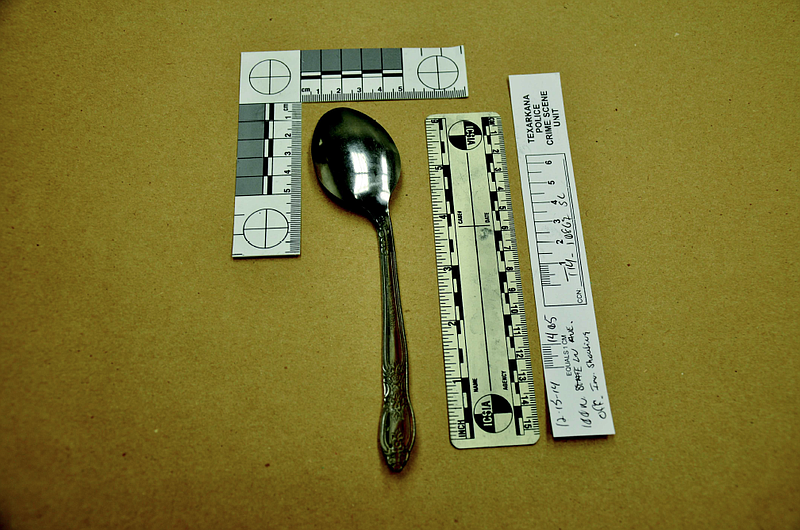 This evidence photo shows the spoon Dennis Grigsby Jr. was holding when he was shot and killed by a police officer in a neighbor's garage in Dec. 15, 2014. The neighbors had called 911 and reported an intruder. The officer said Grigsby acted aggressively and was holding an object that appeared to be a knife. The shooting is the subject of a civil lawsuit.