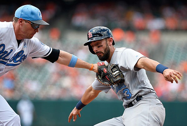 Orioles first baseman Trey Mancini tags out Matt Carpenter of the Cardinals during the fifth inning of Sunday afternoon's game in Baltimore.